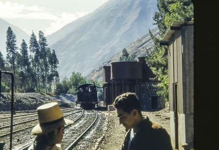 Men, Train and Railroad Tracks in Andes