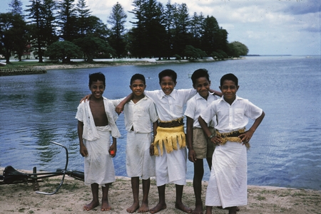 A group of native boys pose for a photo during the luau given to the scientist of the Capricorn Expedition (1952-1953) on ...