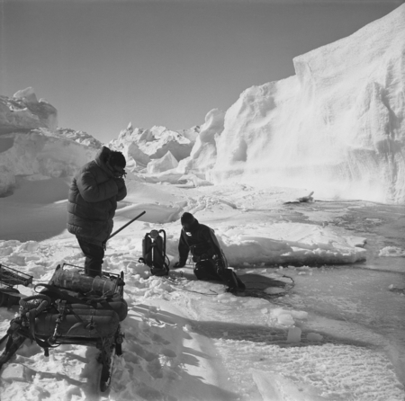 Eugene N. Gruzov (left) and Alexander F. Pushkin (right) at dive hole near iceberg