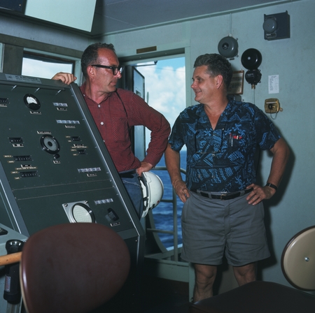 William A. Nierenberg (left) on the bridge of the research ship D/V Glomar Challenger with an unidentified man. William A....