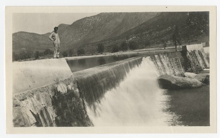 Man posing above spillway at Boulder Creek diverting dam