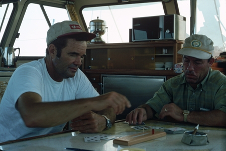 Milton C. Shedd and David M. DeMotte playing cribbage, Sea World Board, albacore fishing trip, about 100 miles south of Sa...