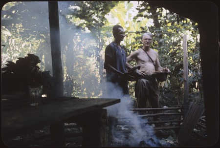 Orofere Valley, Tahiti: archaeologist Kenneth Emory and Tahitian man, cook house in foreground