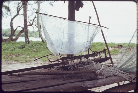 Model canoe with sail made of plastic, models like this were raced by men in former times