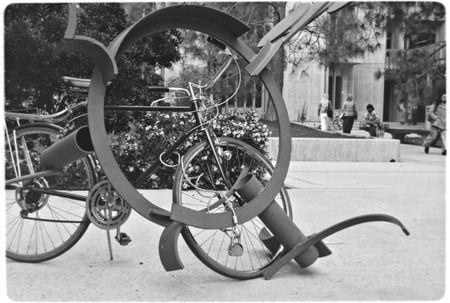 Bicycle chained to sculpture