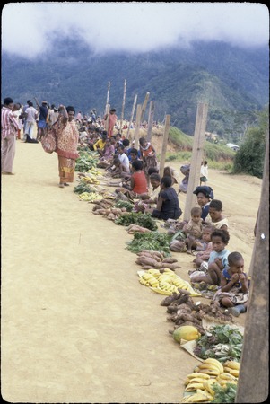 Tabibuga: women selling bananas, sweet potatoes, greens and other garden produce at market