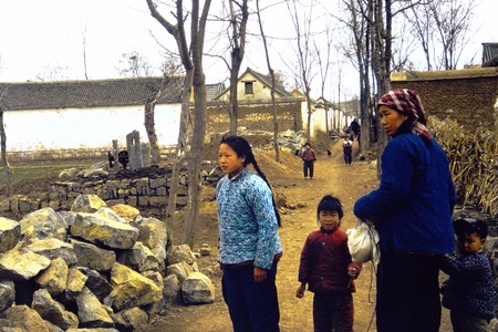 Mother and her children in village