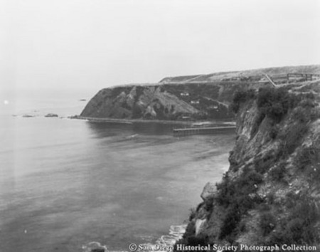 View of San Diego coastline showing ocean, cliffs, and pier