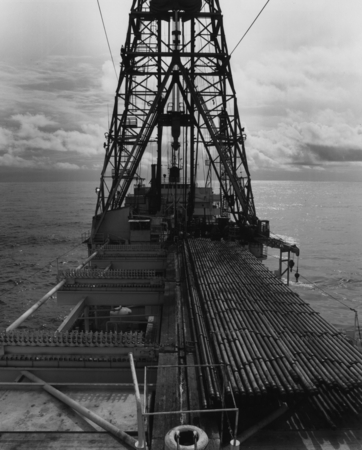 Pipe rack and drilling derrick on board the D/V Glomar Challenger (ship), during one of the legs of the Deep Sea Drilling ...