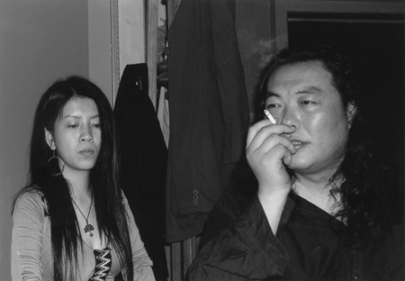 Mei Hualuo and Qi Guo at informal poetry reading in Momo&#39;s apartment in Shanghai