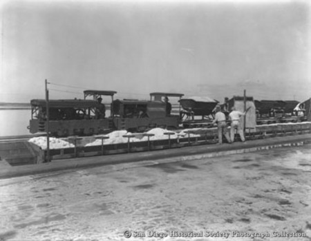 Workers loading salt on to railroad cars at Western Salt Company, Chula Vista