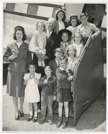 Ed Fletcher with grandchildren boarding a plane to Los Angeles