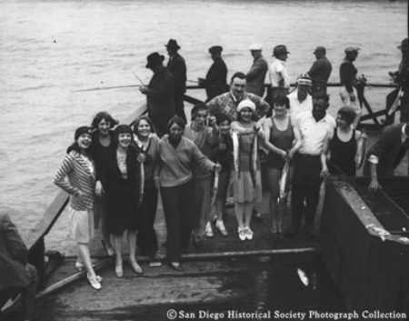 Group of women posing with catch of fish [on fishing barge Point Loma?]