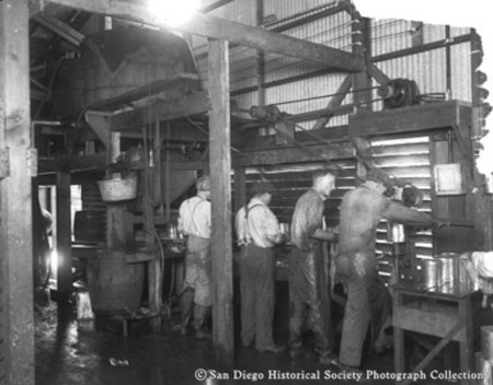 Four men working in [San Pedro Packing Company?] fish cannery