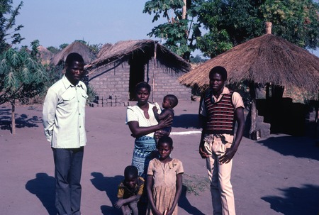 Mr. Rabbon Chola and his family, in front of his home in Kaputa
