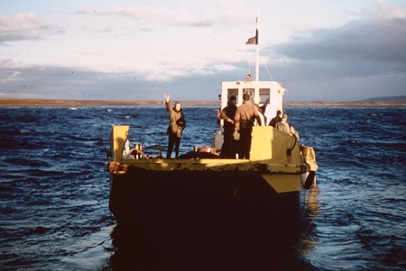 Kerguelen Island Departure [Man waving from Pilot boat]
