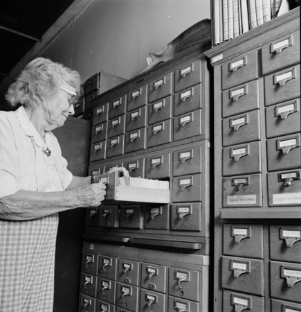 Laura Clark Hubbs with card catalog in the Hubbs Library