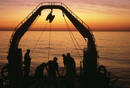 Trawl operation during sunset on R/V Horizon off northern Baja California, Mexico