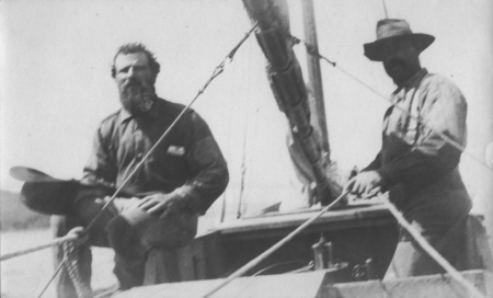 Manual Cabral (left) with an unidentified man, both working on the salvage process of the Loma. The &quot;Loma&quot; was given to th...