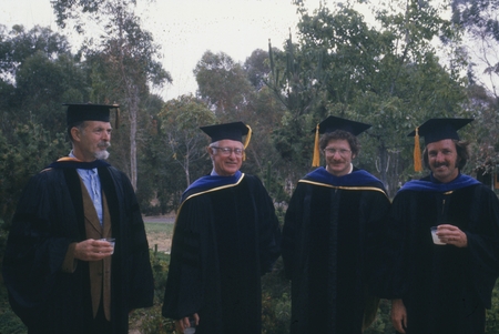 George G. Shor, Fred Noel Spiess, Larry Alan Mayer, Leonard Dale Bibee, in Academic gowns at UCSD Commencement. June 17, 1979