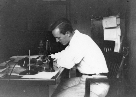 Hugh Bradner at his desk at the California Institute of Technology