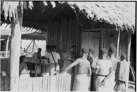 Wanuma: Lutheran missionary, Hildegard Schoettler, and boys on porch of mission clinic