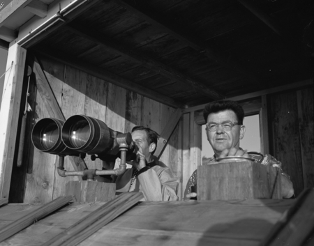 Carl L. (Carl Leavitt) Hubbs and Sam Hinton watch whales through military binoculars at Scripps Institution of Oceanograph...