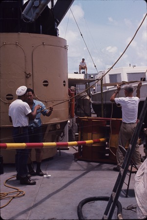 Working with an instrument buoy, aboard the USC&amp;GS Pioneer during the International Indian Ocean Expedition. 1964