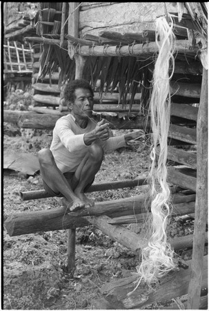 Mogiovyeka, smoking cigarette and making a fishing net