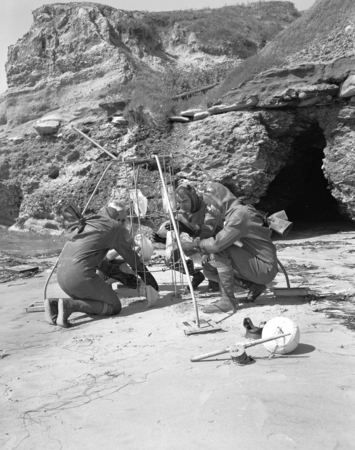 Donald Sayner, Ruth Young, David Poole and Robert M. Norris in diving suits with sediment trap, Scripps Beach, La Jolla