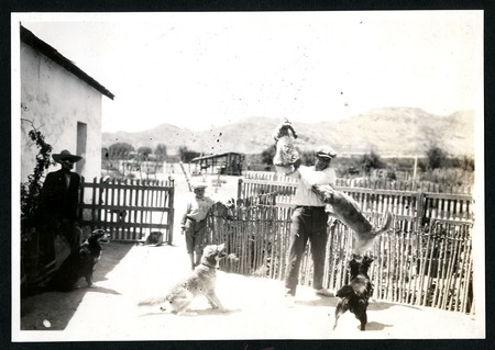 Ruperto Espinoza Arce playing with dogs in El Rosario