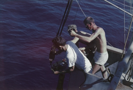 Arthur Eugene Maxwell, and others, deploying a oceanographic instrument off the fantail of the R/V Horizon during the MidP...