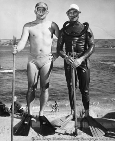 Bob Wedgewood and Chuck Boswell in diving gear with fishing spears