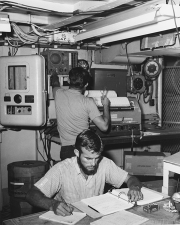 Two students work in the laboratory of the Horizon on Vermilion Sea Expedition to the Gulf of California. 1959