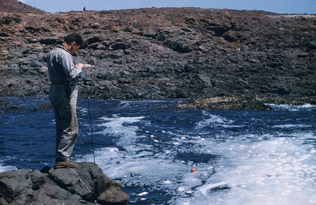 Carl L. Hubbs conducting temperature survey with float during surge, south of Punta Calaveras, Baja California, Mexico