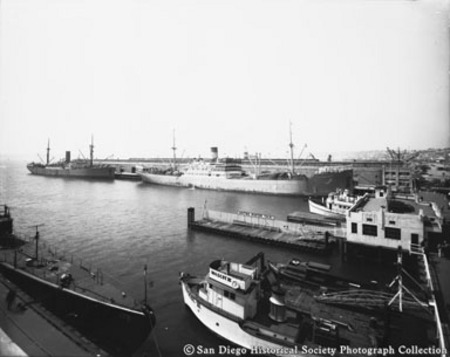 General view of San Diego waterfront showing boats, ships, and piers