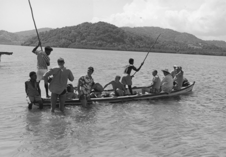 Roger Revelle, Robert Dietz, and Russell W. Raitt on their way back to Viti Levu, after a day of diving with the Fijians o...