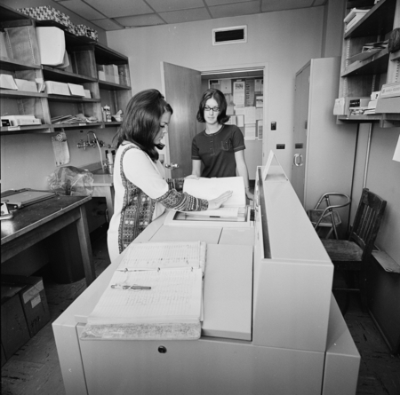 Women using photocopy machine, Central Duplicating Center, UC San Diego