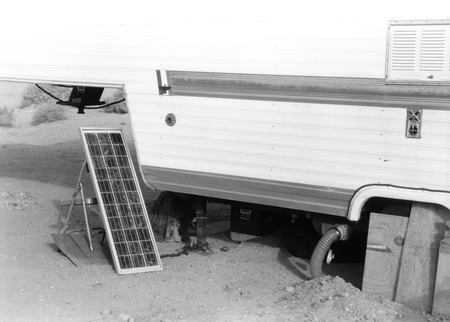 Slab City: photograph of trailer and solar panel