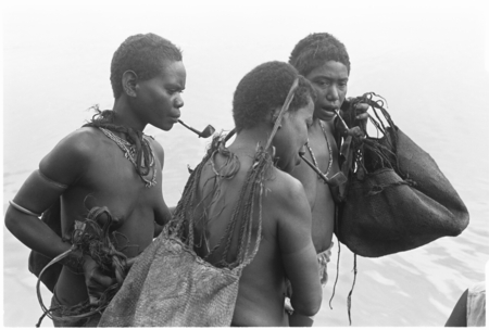 Trading with saltwater (coastal) women in the canoes. Bush women.