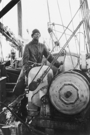Working in bad conditions [Man at winch on R/V E.W. Scripps]