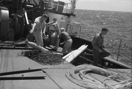 [Men with sonabuoy and cables on deck of R/V Spencer F. Baird]