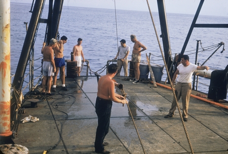 [Oceanographers deploying corer from deck of R/V Spencer F. Baird]