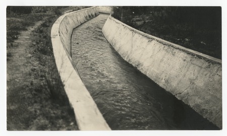 Water flowing in concrete channel approaching Sand Creek siphon, San Diego flume