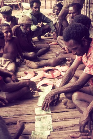 Men readying pearlshells and currency (money) for ceremonial distribution
