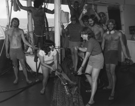 Women technicians at work on the fantail of the D/V Glomar Challenger (ship) while being supervised by the boys during a l...
