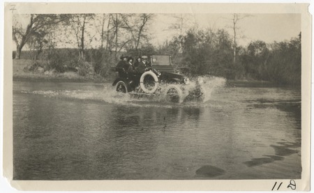 Crossing a creek in an automobile following the 1916 flood