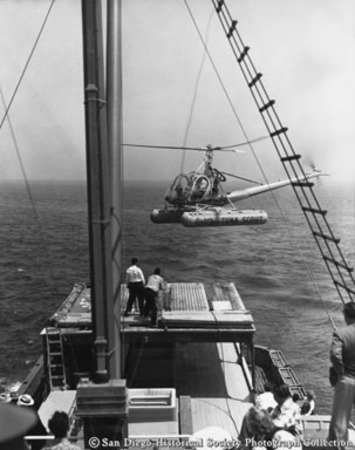 Tuna Scout helicopter landing on stern canopy of tuna boat Chicken of the Sea