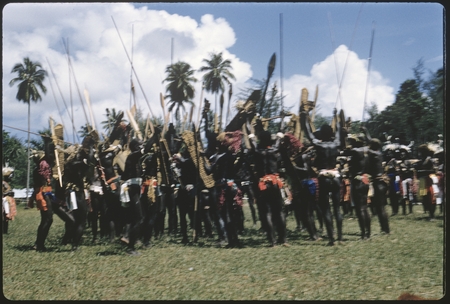 Dancers with shields; large official gathering
