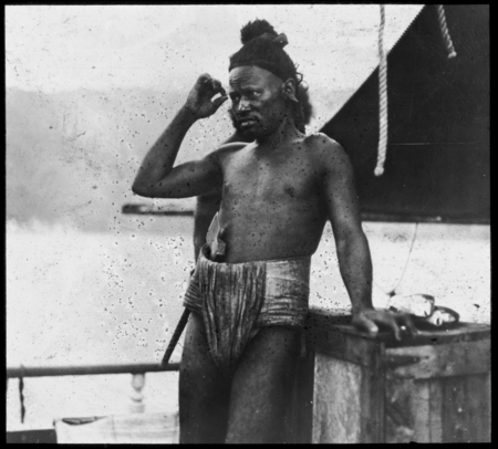 Man on ship with axe in waist cloth